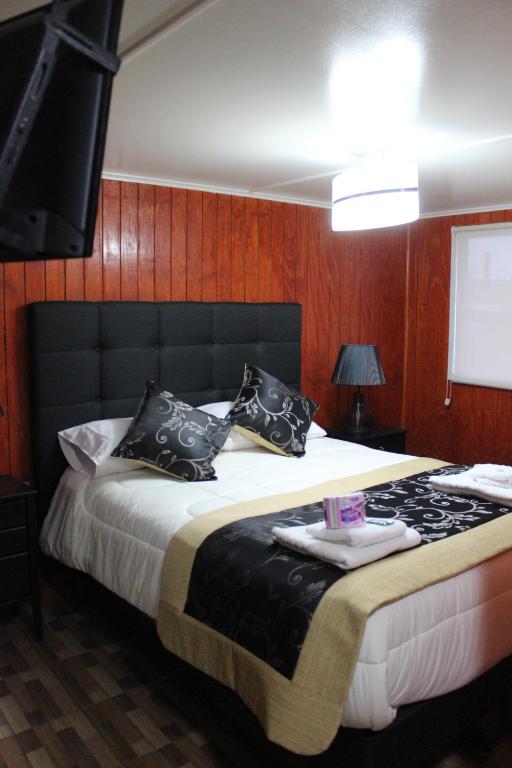 Postel nebo postele na pokoji v ubytování Hotel Forjadores del Cabo de Hornos