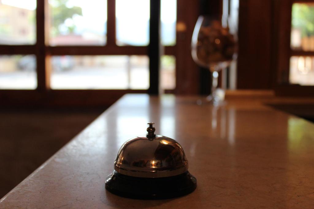 a bell sitting on top of a table at B&B La Vigna in Lamezia Terme