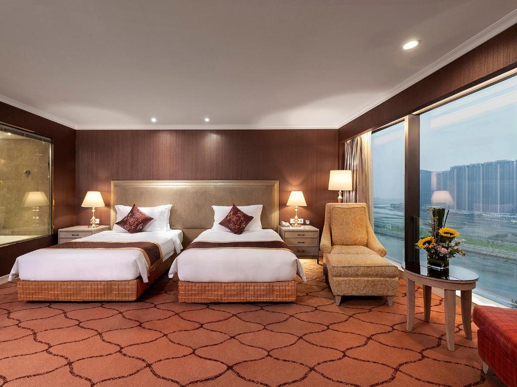 Postel nebo postele na pokoji v ubytování Similan Hotel Zhuhai-Gongbei Port