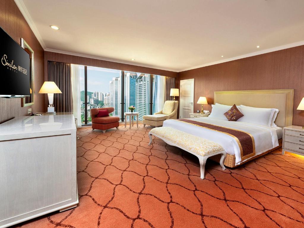 Postel nebo postele na pokoji v ubytování Similan Hotel Zhuhai-Gongbei Port