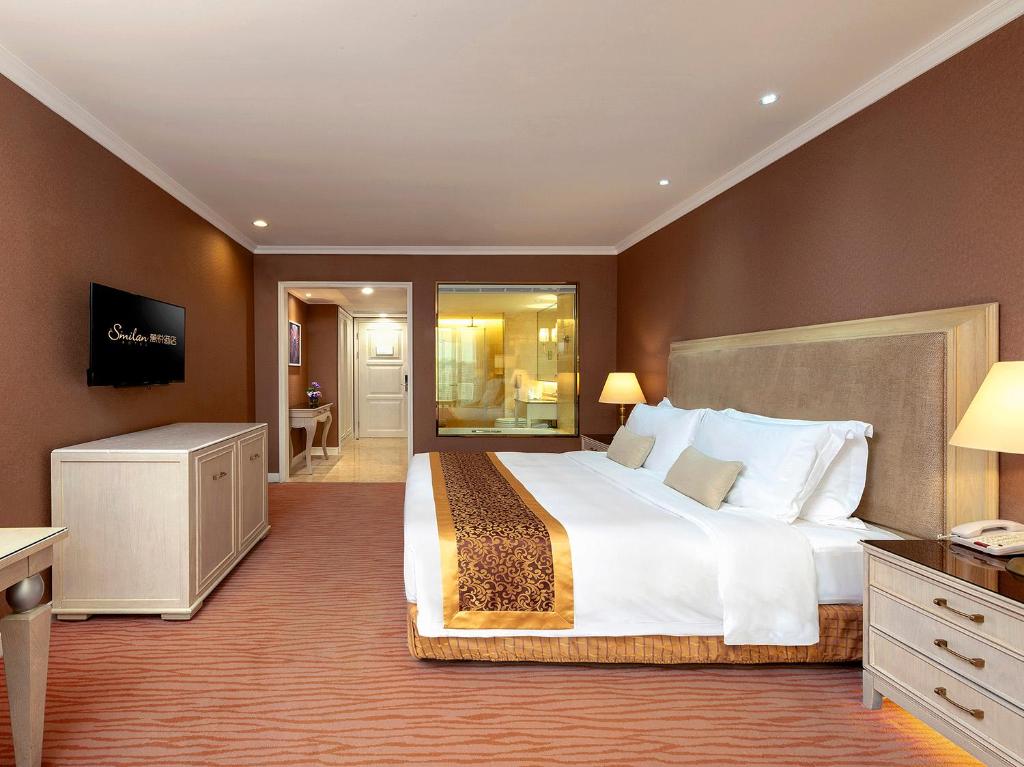 Postel nebo postele na pokoji v ubytování Similan Hotel Zhuhai-Gongbei Port