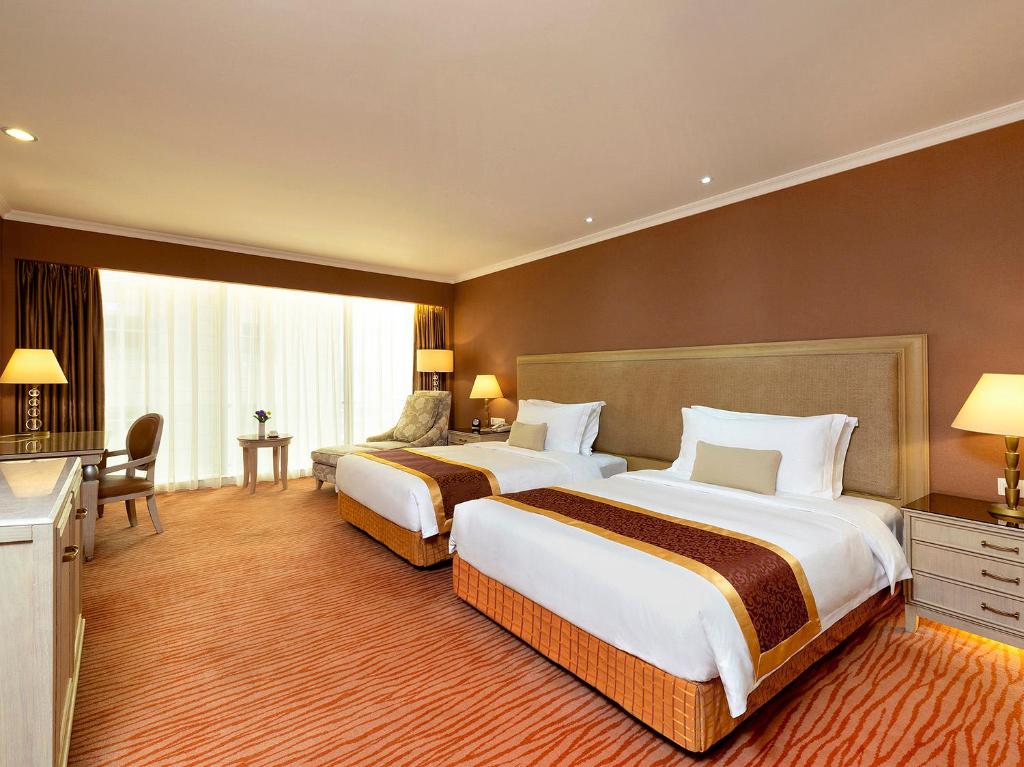 Postel nebo postele na pokoji v ubytování Similan Hotel Zhuhai-Gongbei Port