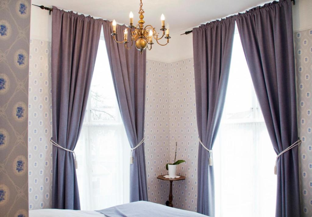 Postel nebo postele na pokoji v ubytování Hotel Kong Carl - Unike Hoteller