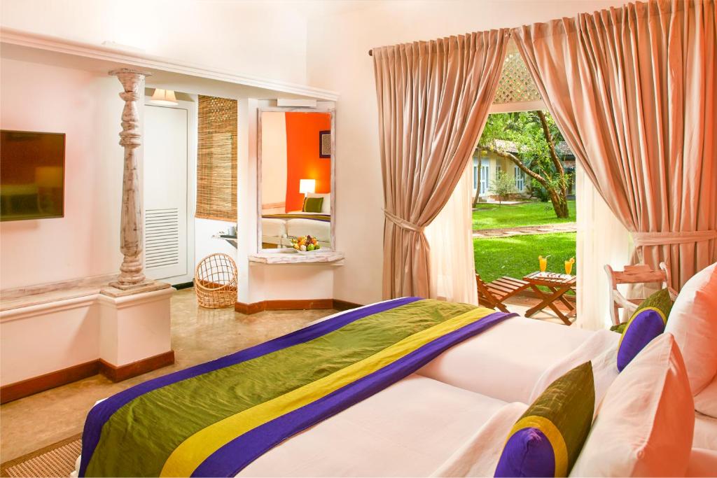 Postel nebo postele na pokoji v ubytování Hotel Sigiriya
