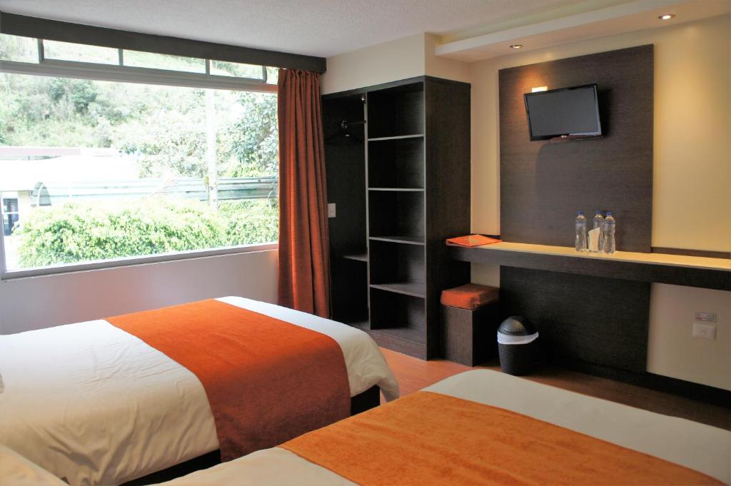 Postel nebo postele na pokoji v ubytování Monte Selva Hotel Spa Termal