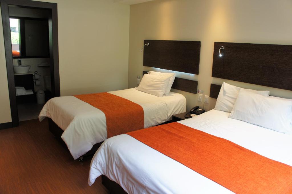 Postel nebo postele na pokoji v ubytování Monte Selva Hotel Spa Termal