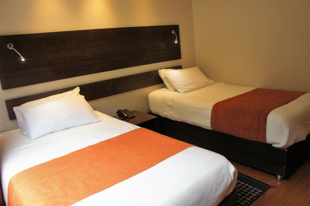 Postel nebo postele na pokoji v ubytování Monte Selva Hotel Spa Termal