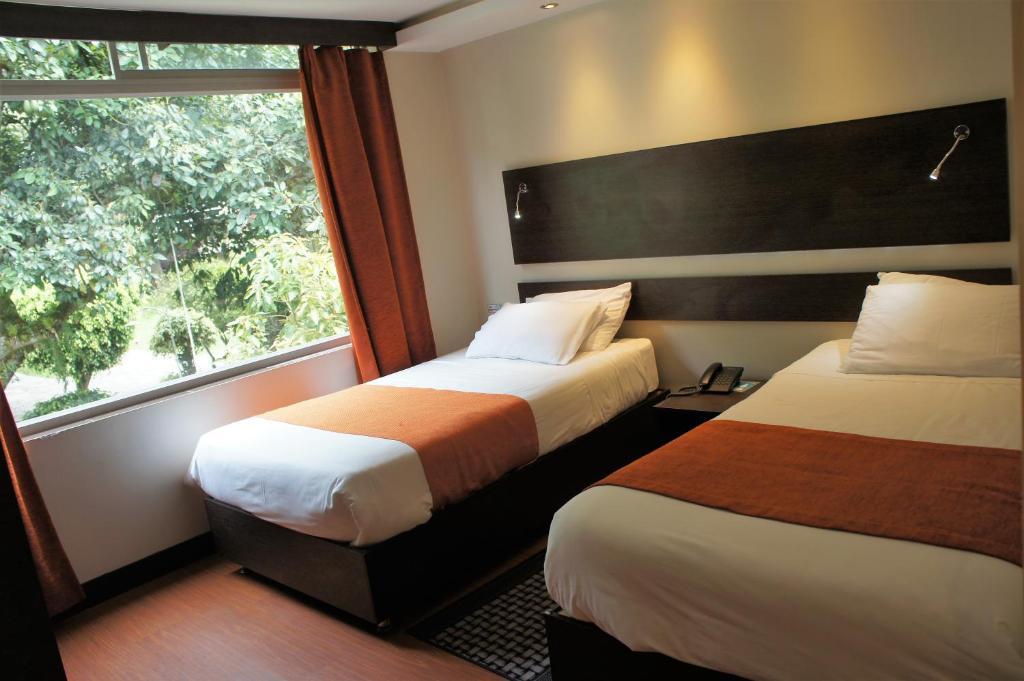 Postel nebo postele na pokoji v ubytování Monte Selva Hotel Spa Termal