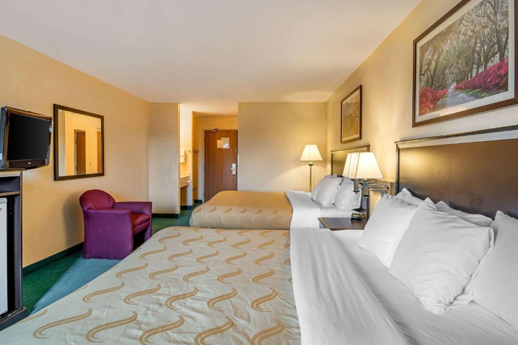 Postel nebo postele na pokoji v ubytování Quality Inn