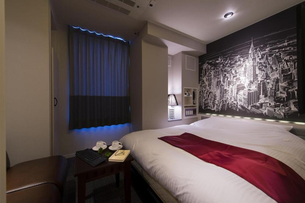 Postel nebo postele na pokoji v ubytování The CALM Hotel Tokyo