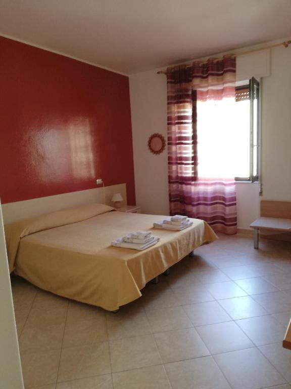 Postel nebo postele na pokoji v ubytování B&B Casa Mia