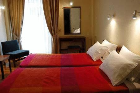 Postel nebo postele na pokoji v ubytování Hotel Alexandros