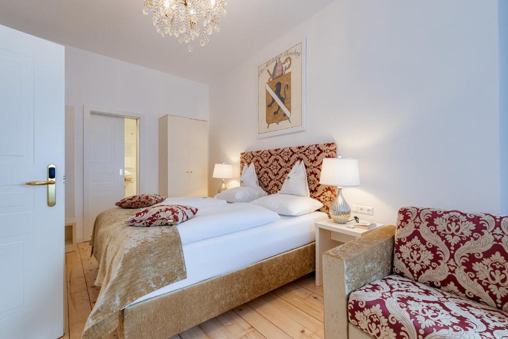 Voodi või voodid majutusasutuse Boutique Hotel Goldenes Lamm Villach toas