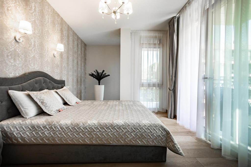 Postel nebo postele na pokoji v ubytování FoRest Apartments
