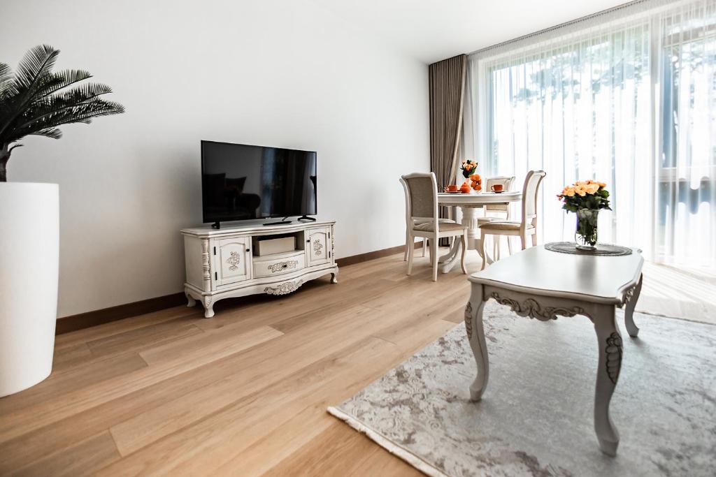 TV a/nebo společenská místnost v ubytování FoRest Apartments