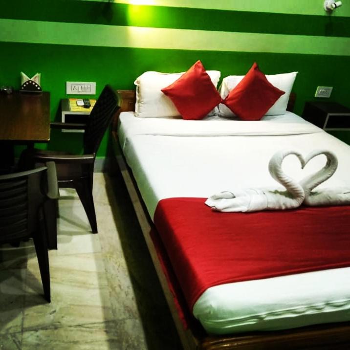 Postel nebo postele na pokoji v ubytování Ratna Resort near Bhubaneswar Airport