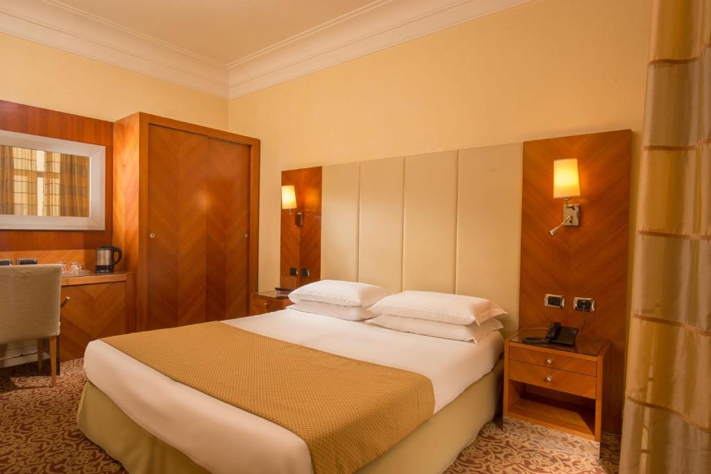 Posteľ alebo postele v izbe v ubytovaní Suite Opera Rooms