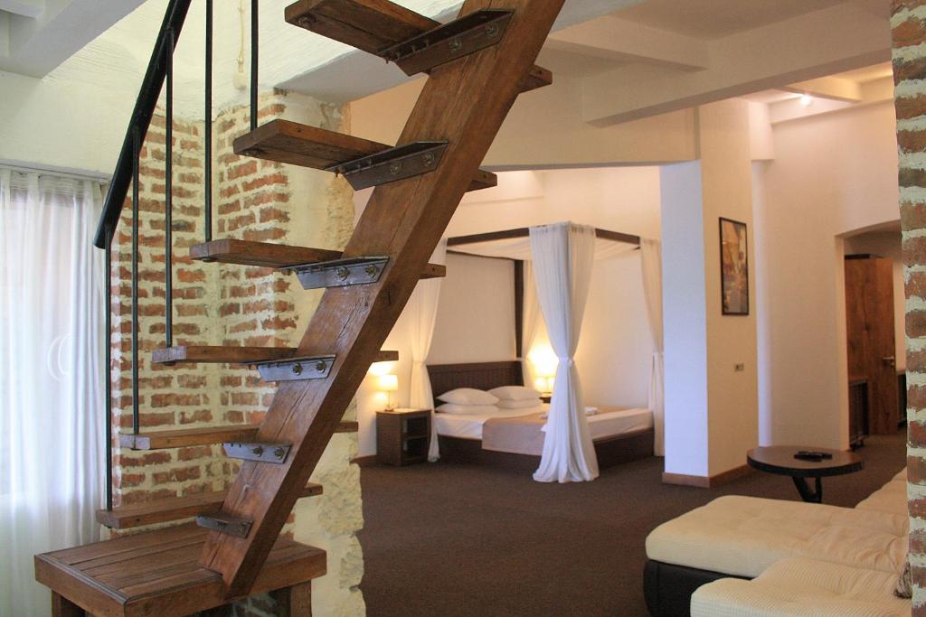Postel nebo postele na pokoji v ubytování DEM Hotel