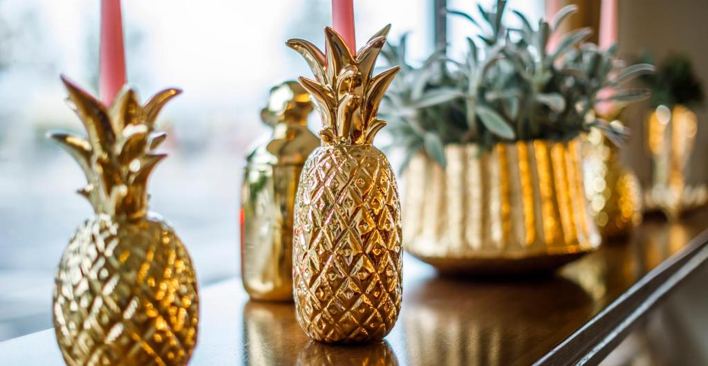 a group of gold vases sitting on a table at Hotel Bellevue - Liburnia in Opatija