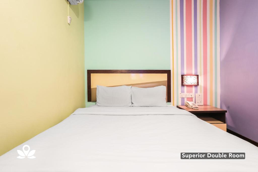 Postel nebo postele na pokoji v ubytování Hotel Weilia