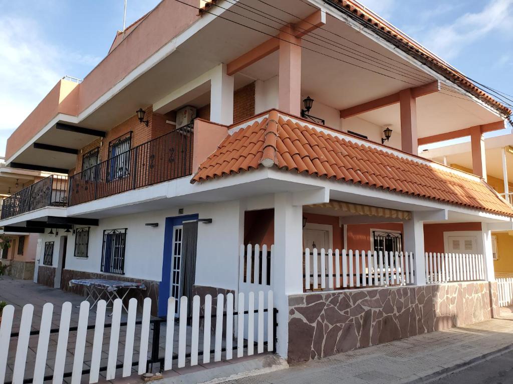 a house with a white fence in front of it at House Mare Nostrum in Moncófar