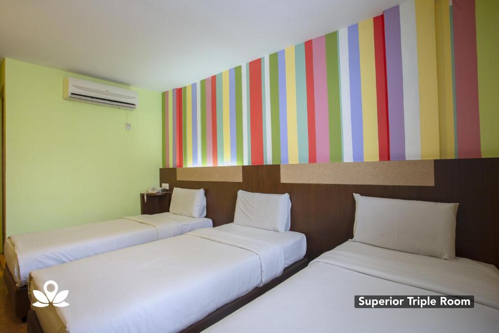 Postel nebo postele na pokoji v ubytování Hotel Weilia