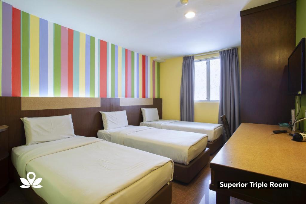 Postel nebo postele na pokoji v ubytování Hotel Weilia