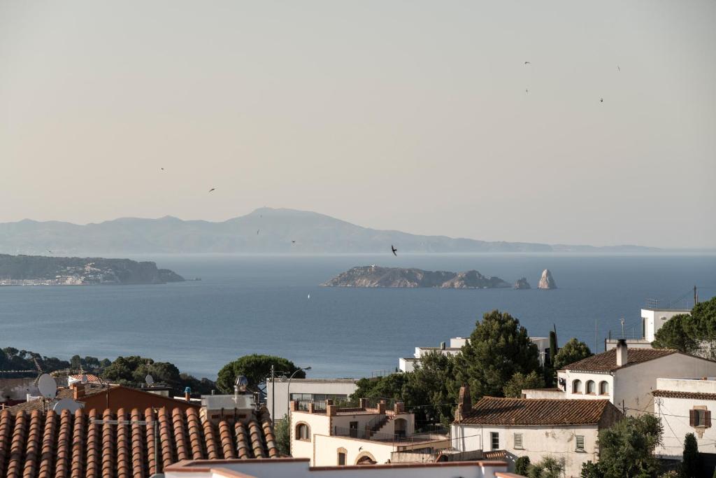 a view of the ocean from a city at Alta House Begur in Begur