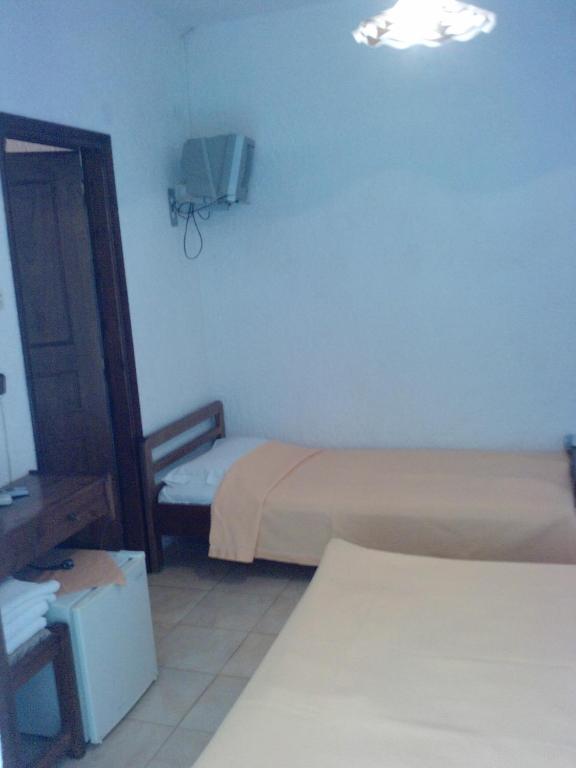 Postel nebo postele na pokoji v ubytování Hotel Lefkes