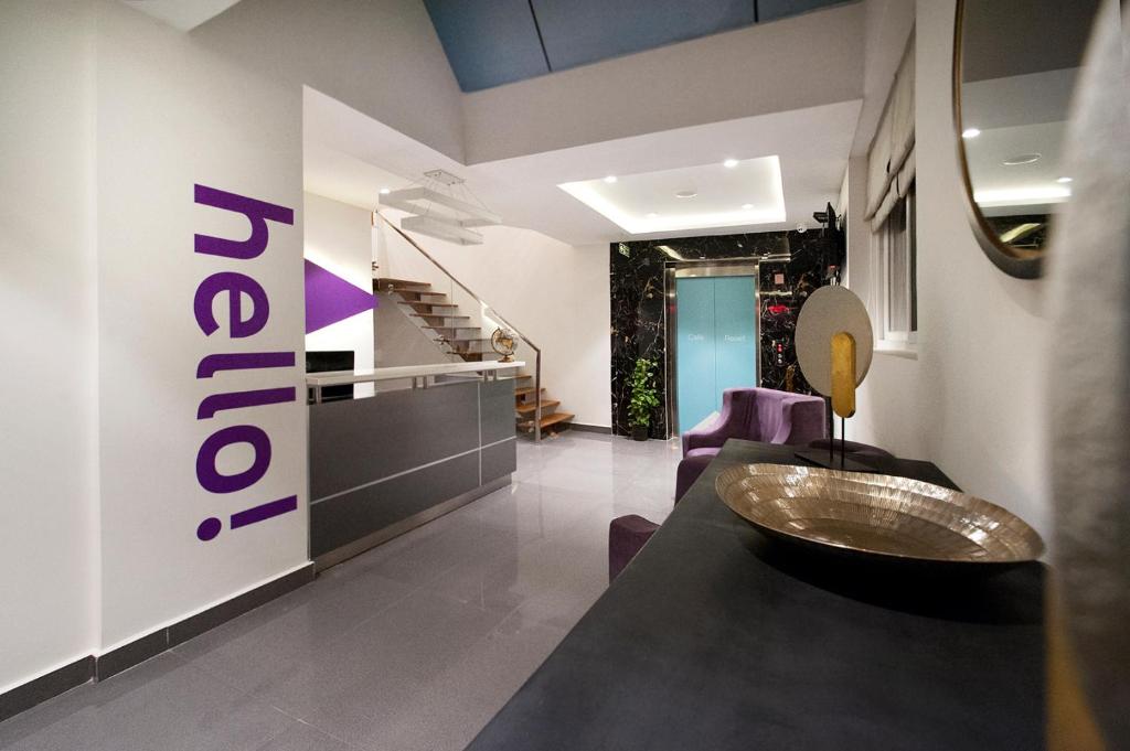 a bathroom with a sink and a staircase in a room at Raj Residency in Bangalore