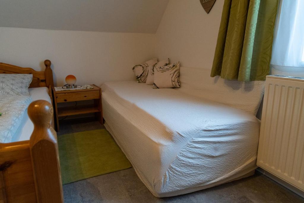 Postel nebo postele na pokoji v ubytování Haus Lebensfreude