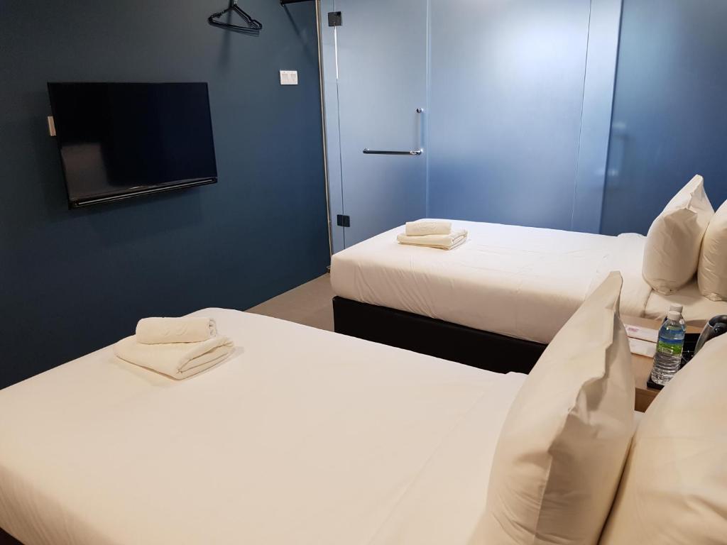 TV a/nebo společenská místnost v ubytování Bloommaze Boutique Hotel Klang