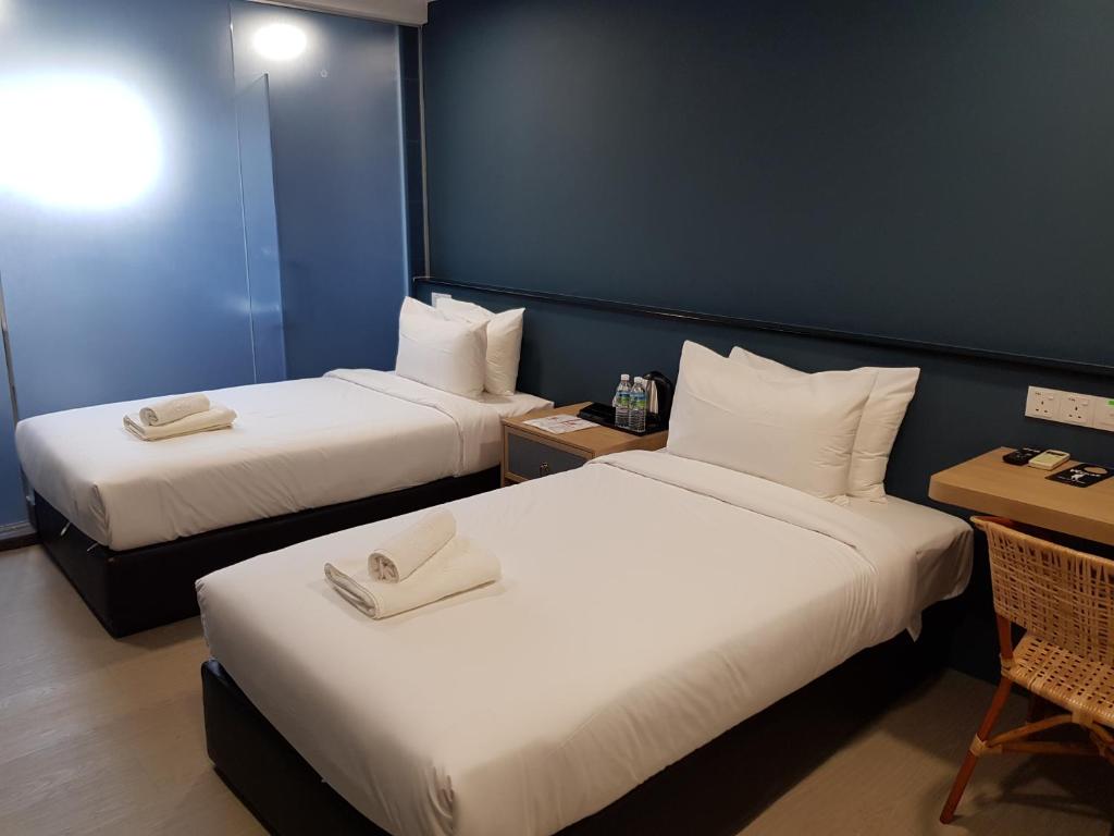Postel nebo postele na pokoji v ubytování Bloommaze Boutique Hotel Klang