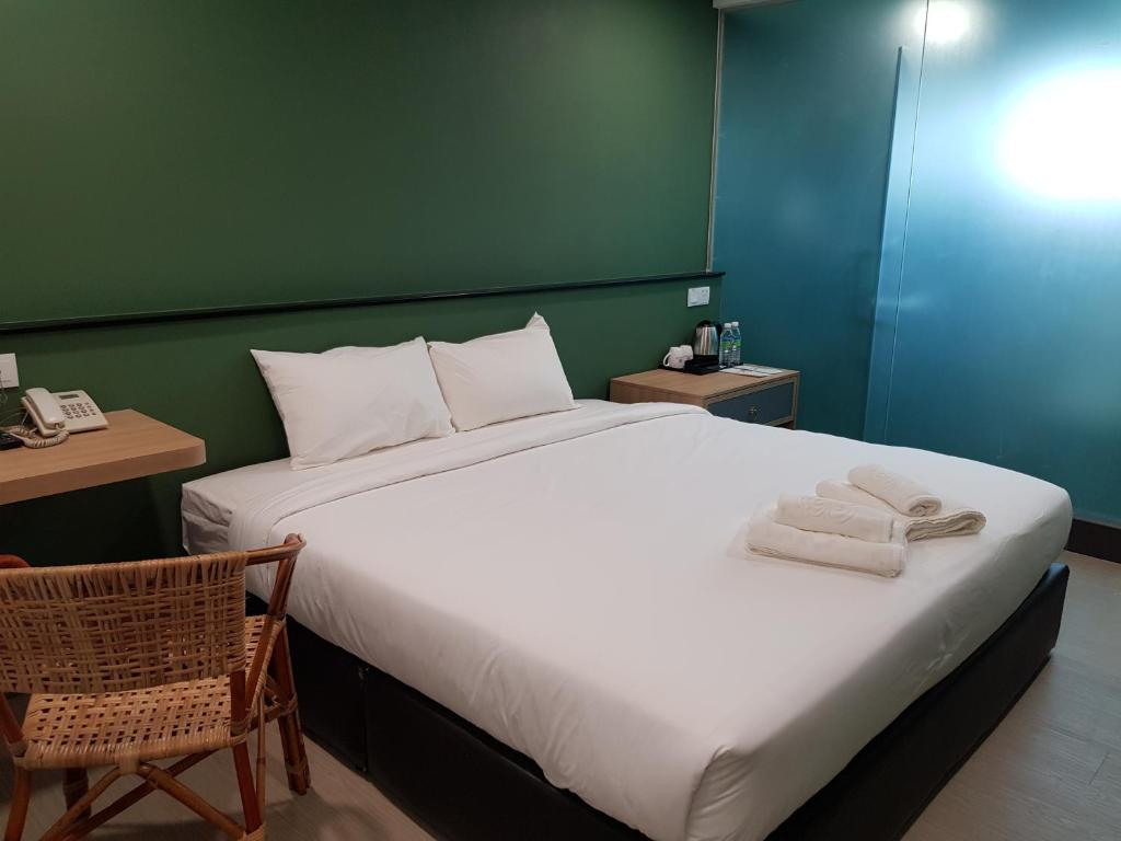 Postel nebo postele na pokoji v ubytování Bloommaze Boutique Hotel Klang