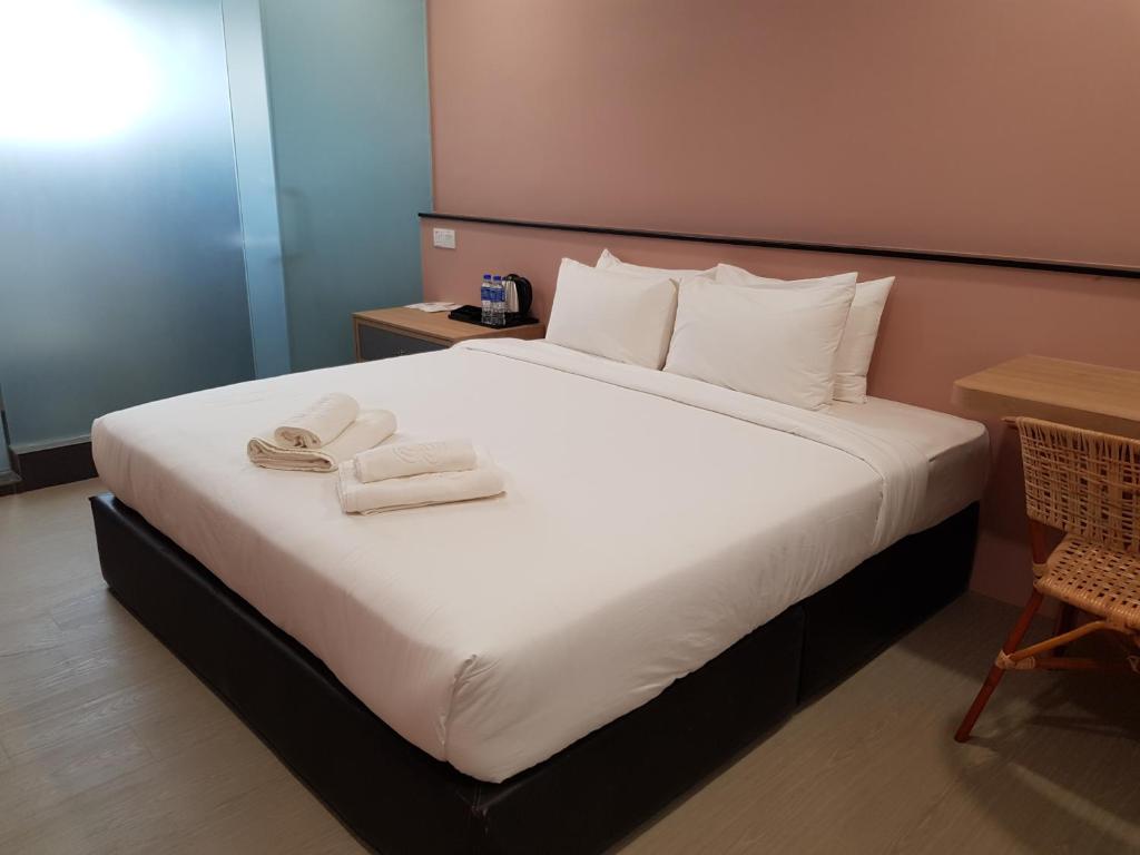 Postel nebo postele na pokoji v ubytování Bloommaze Boutique Hotel Klang
