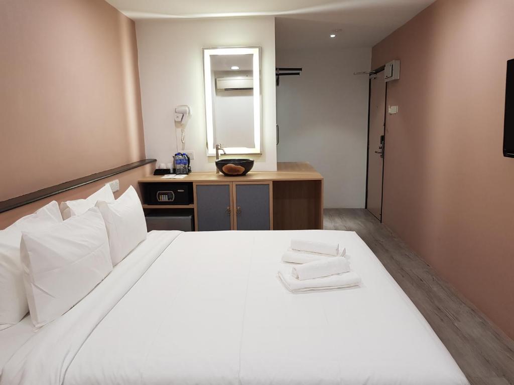 Postel nebo postele na pokoji v ubytování Bloommaze Boutique Hotel Klang