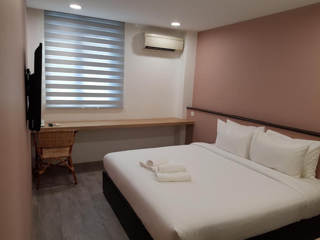 Postel nebo postele na pokoji v ubytování Bloommaze Boutique Hotel Klang