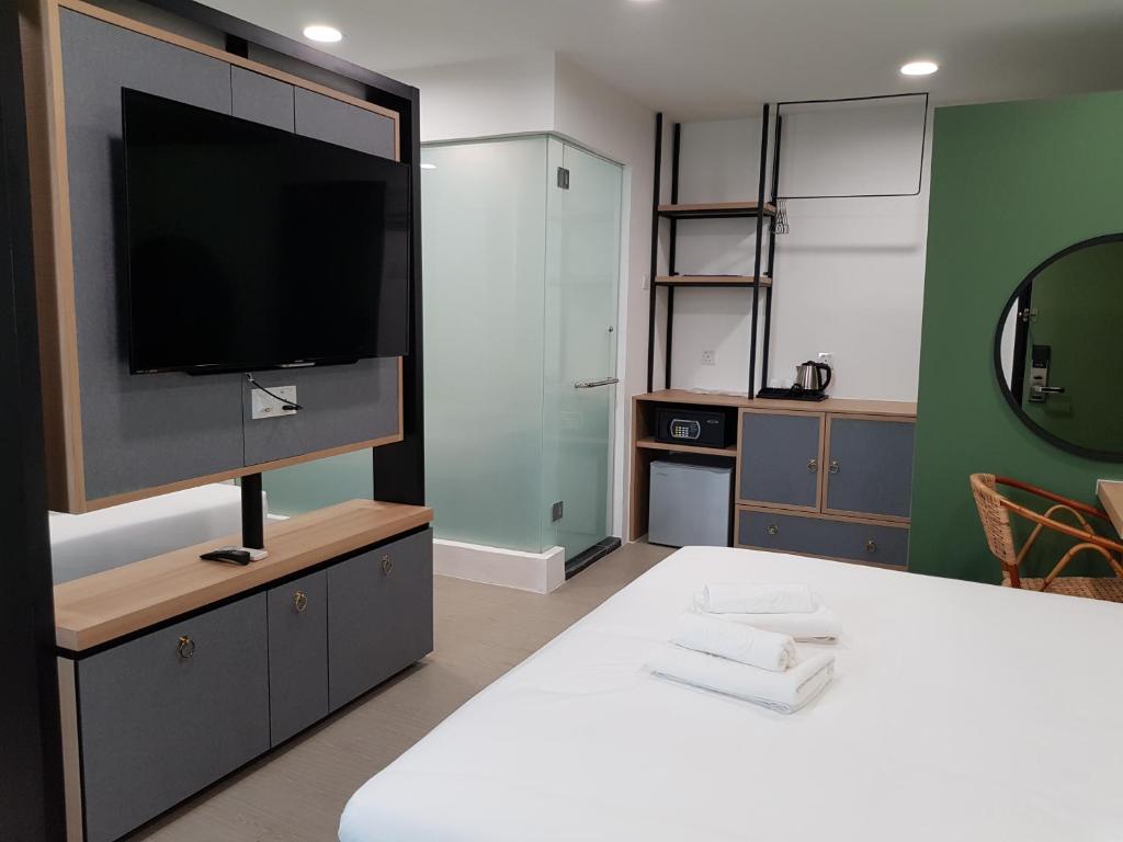 Postel nebo postele na pokoji v ubytování Bloommaze Boutique Hotel Klang