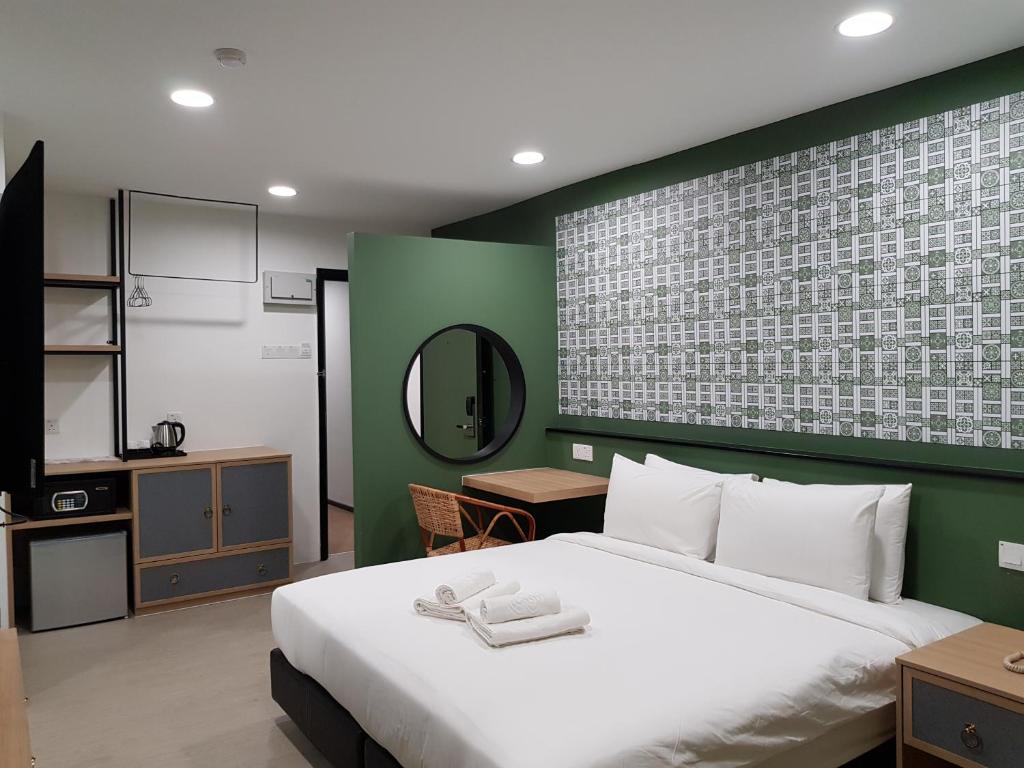 Postel nebo postele na pokoji v ubytování Bloommaze Boutique Hotel Klang