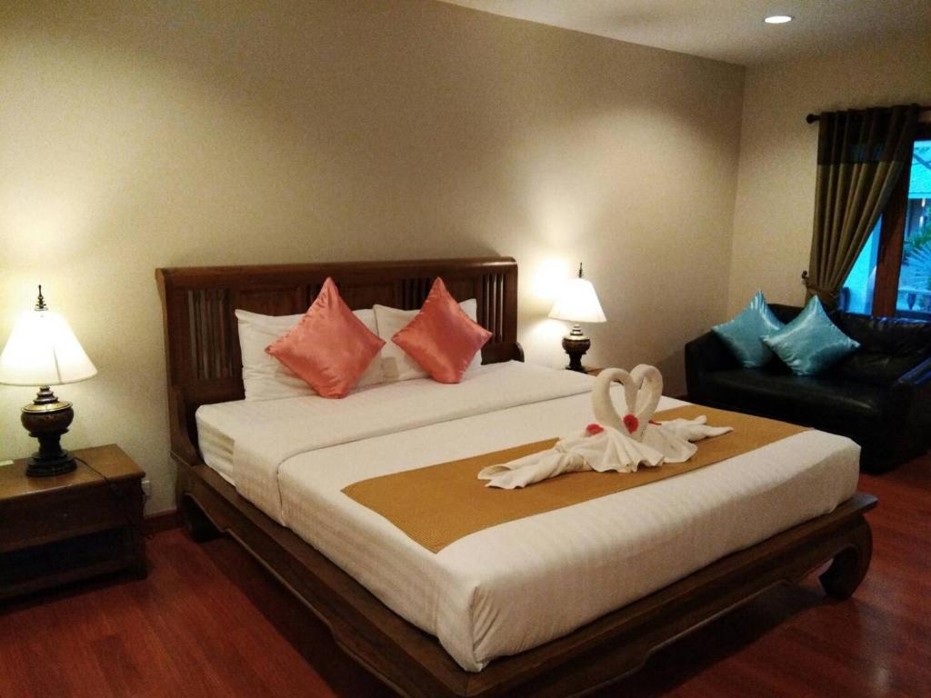 Postel nebo postele na pokoji v ubytování Scent of Sukhothai Resort