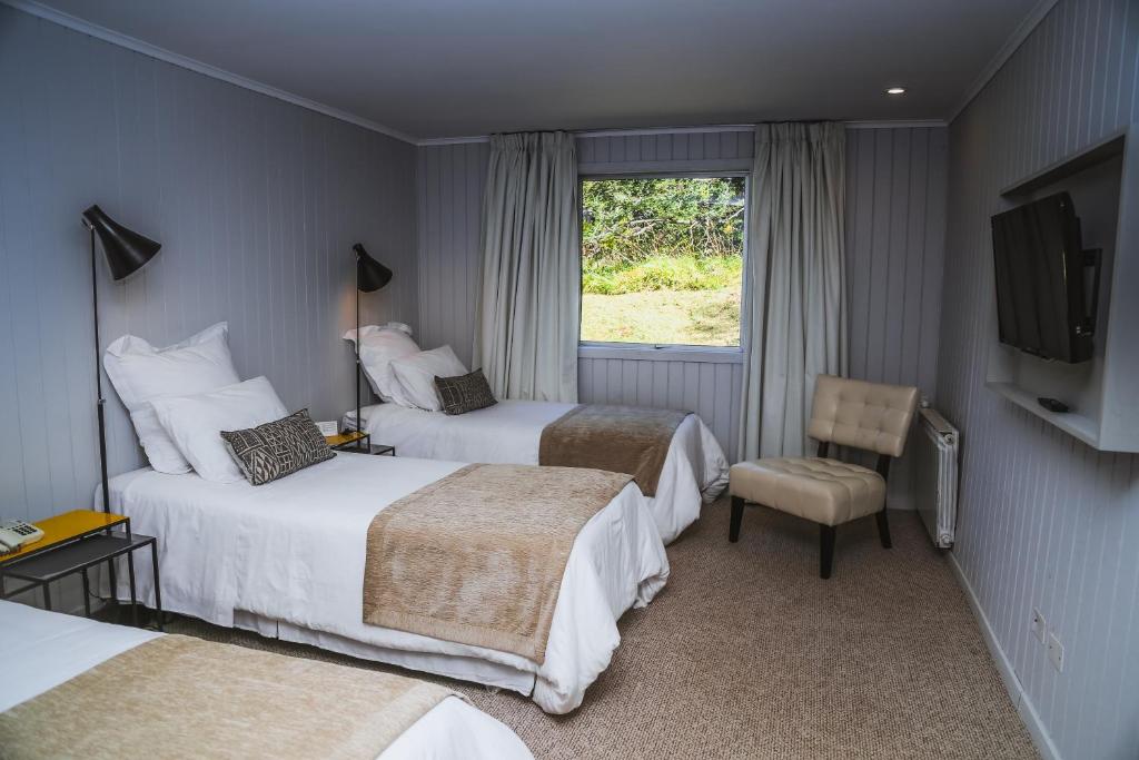 Postel nebo postele na pokoji v ubytování Hotel Lago Grey