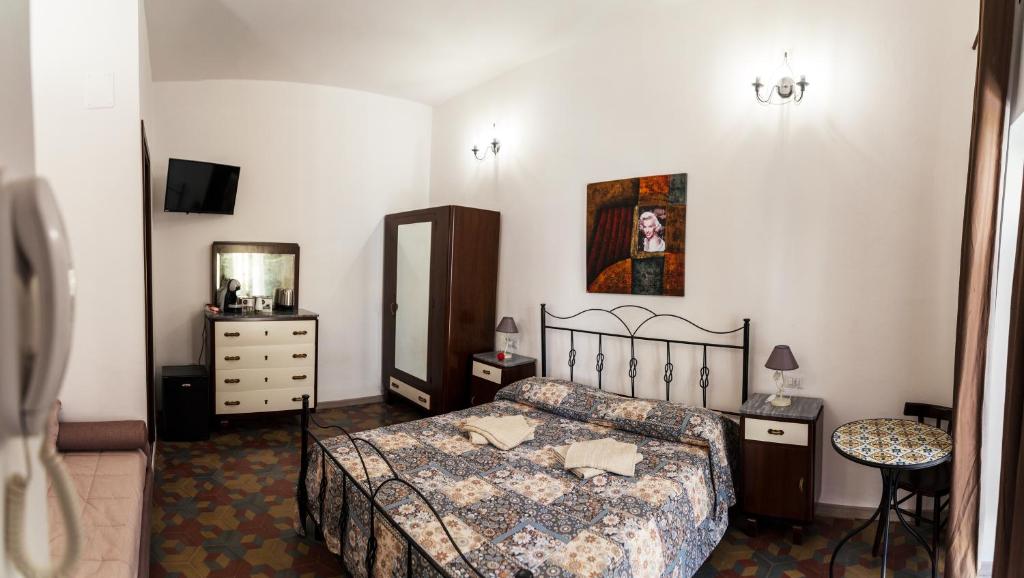 Posteľ alebo postele v izbe v ubytovaní Casa degli Artisti Diamante