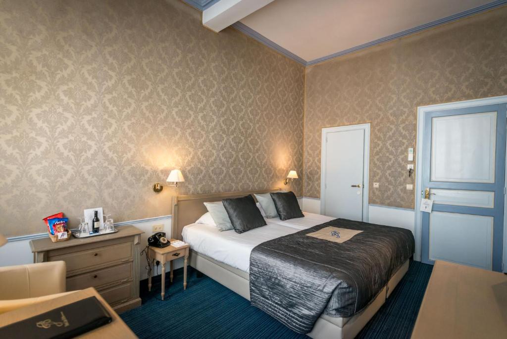 Postel nebo postele na pokoji v ubytování Hotel Jan Brito
