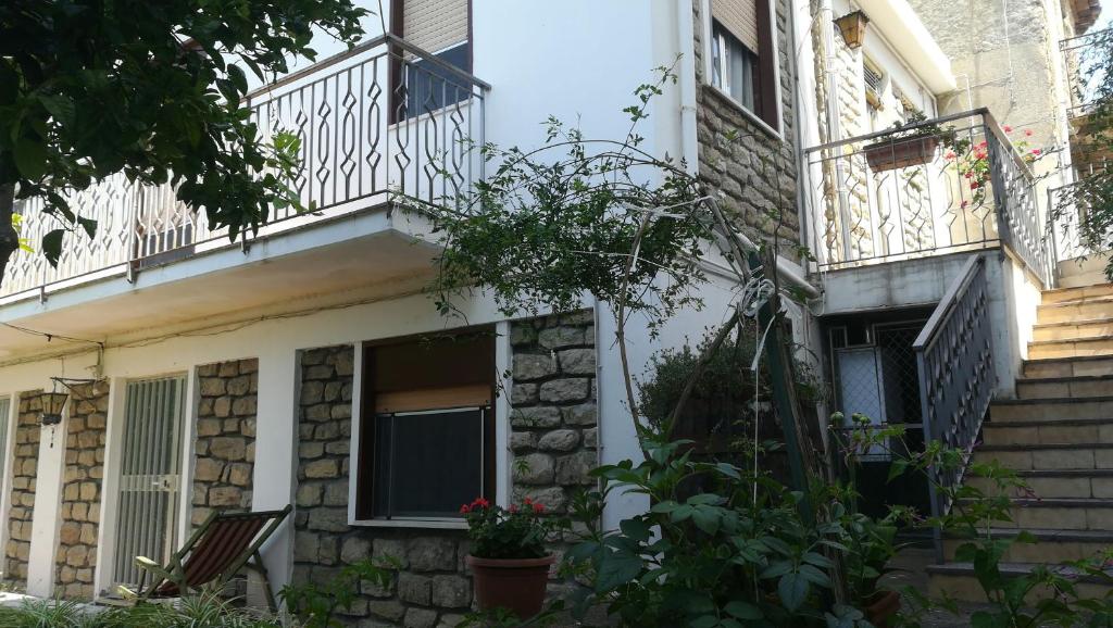 a building with two balconies and a window at Borgo San Biagio in Basicò