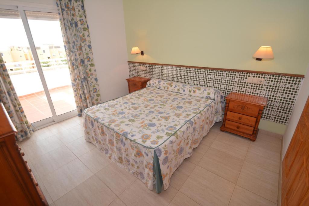 Posteľ alebo postele v izbe v ubytovaní Apartamentos Mexico