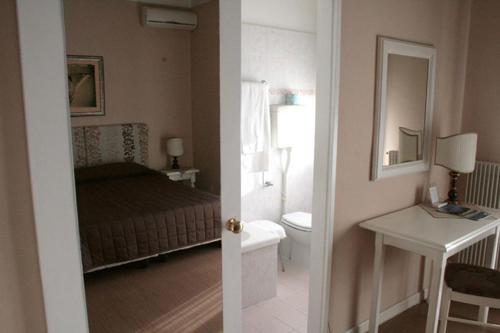 Postel nebo postele na pokoji v ubytování Hotel Ristorante La Rua