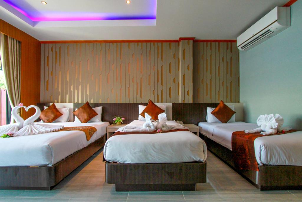 Postel nebo postele na pokoji v ubytování Coco Bella Hotel