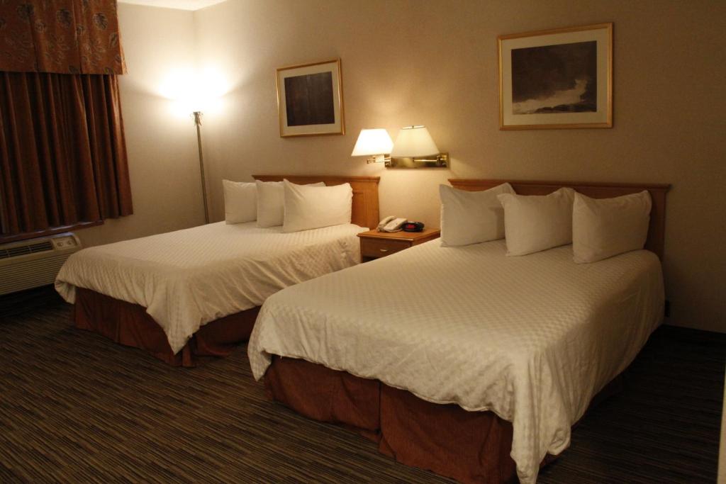 Cama o camas de una habitación en Humphry Inn and Suites