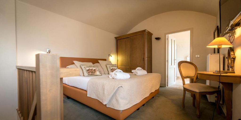 Postel nebo postele na pokoji v ubytování Hotel Jan Brito