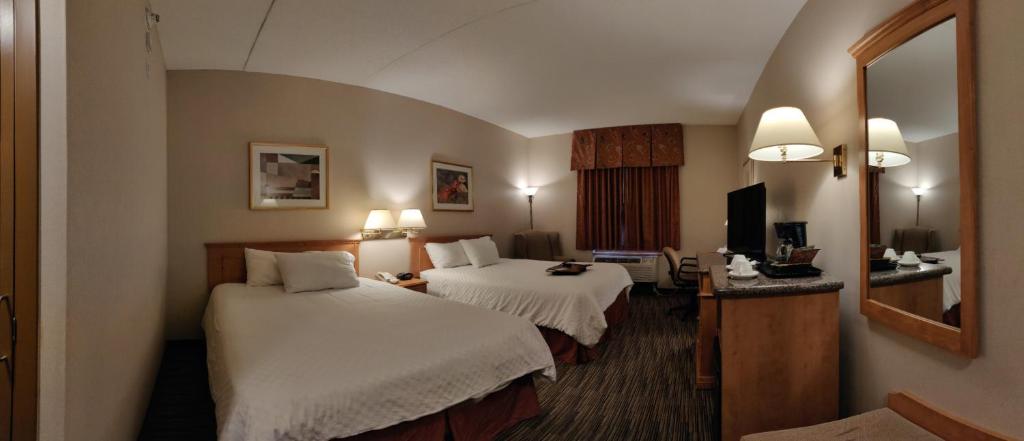 Cama o camas de una habitación en Humphry Inn and Suites